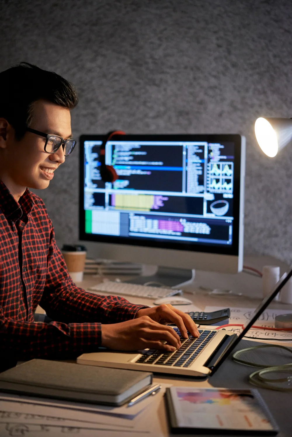 Professional working with technology at a workstation